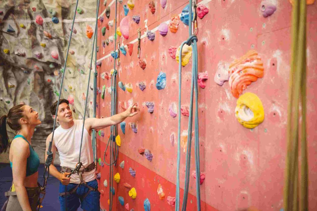 A couple in Rock Climbing gym; Fun Valentine's Day Date Ideas in 2022 for Couples Mad In Love