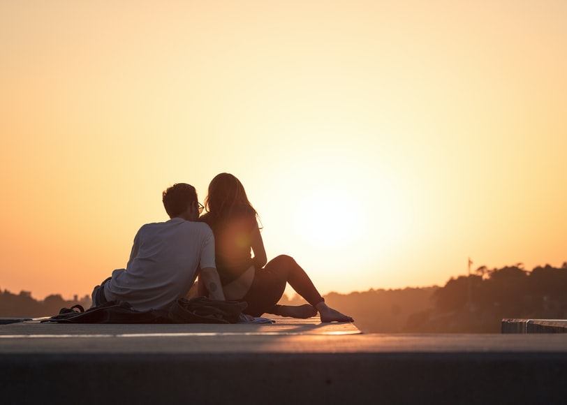 Couple watching Sunset; Fun Valentine's Day Date Ideas in 2022 for Couples Mad In Love