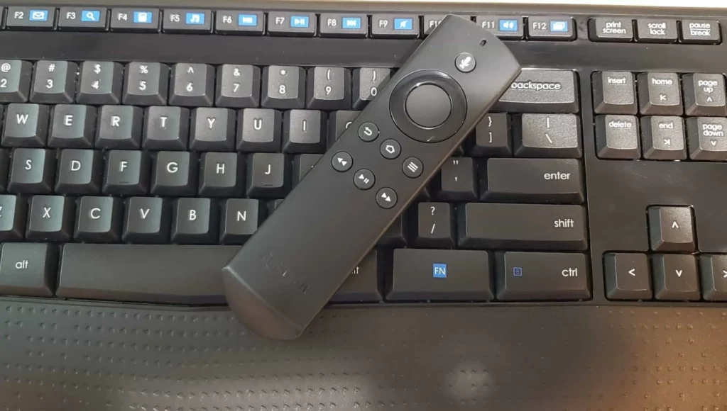 A firestick remote on top of a keyboard; How to reset Firestick without a remote