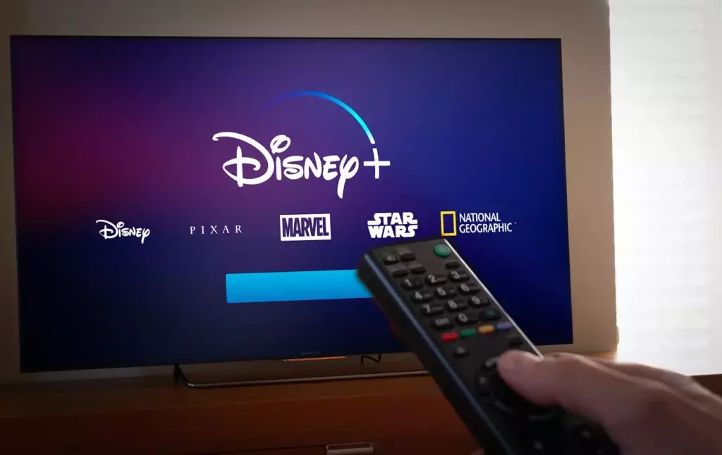 Disney + logo; How to Log Out of Disney Plus on Roku? New Easy Steps Guide